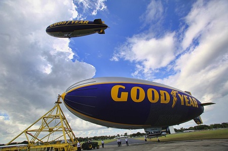 The Spirit of Innovation is on the ground as The Spirit of Goodyear flies overhead.  Photo: Mike Stocker / Sun Sentinel