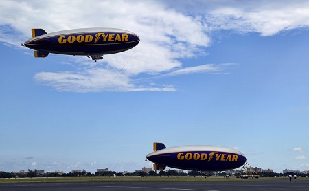 The Spirit of Innovation is on the ground as The Spirit of Goodyear flies overhead.  Photo: Mike Stocker / Sun Sentinel