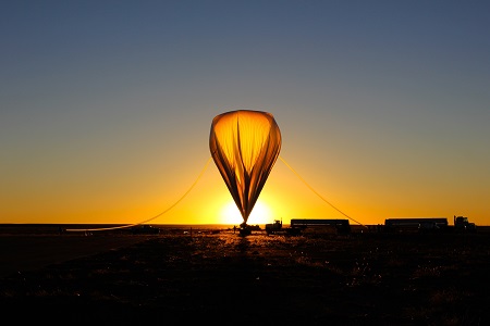 The high-altitude balloon that carried the HySICS instruments to the outermost part of Earth's atmosphere was inflated with helium at sunrise on the morning of Sept. 29, 2013. Photo: HySICS Team/LASP 