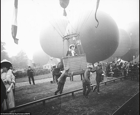 One of the few photographs showing a lady aboard a balloon. 