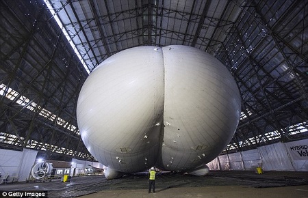 The world's longest aircraft - part airship, plane and helicopter - has been unveiled in Cardington, Bedfordshire. It will be used for surveillance and aid missions. Source: Daily Mail UK