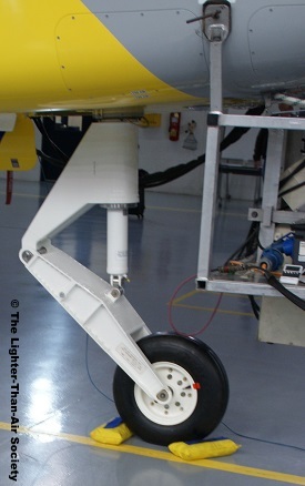 Front landing gear attached to the gondola.