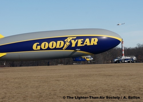 The escort helicopter flies over the new blimp moments before it separates from the mooring mast. Photo: A. Bellon - LTAS