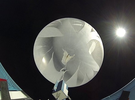 A rack of experiments is sent up via balloon, which explodes at the desired altitude (shown: early stage of the explosion sequence) to initiate descent back to Earth. Photo:  JP Aerospace.