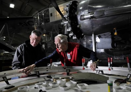 John Craggs of Marlborough, left, and Russ Magnuson of Southington, right, work on fabricating new engine cowlings for the Goodyear ZNPK-28 Blimp Control Car.