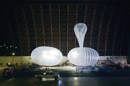 The helium balloons are inflated to the size they reach in the stratosphere. The “ballonets” inside are filled with air or emptied to make the balloon fall or rise. Image courtesy of MIT Technology Review