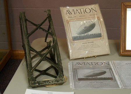 Part of a girder recovered from the crash site and a copy of Aviation magazine published Sept. 10, 1923 reporting on the maiden flight of the USS Shenandoah. Photo: © Alvaro Bellon