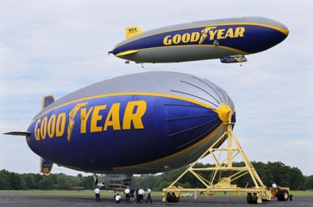 The Goodyear airship Wingfoot One (right) takes flight over the Spirit of Innovation at the company's airship base on Wednesday in Suffield Township.  Photo: Michael Chritton/Akron Beacon Journal