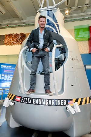Austrian pilot Felix Baumgartner stands on the capsule used for his historic freefall on October 14, 2012 and now on show at the Ontario Science Centre.  Photo: CNW Group/Ontario Science Centre