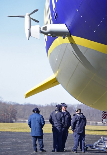 Goodyear support crew stand next to the second new technology airship during engine tests Saturday at the Wingfoot Lake blimp base in Suffield Township. Photo: David Dermer - Akron Beacon Journal