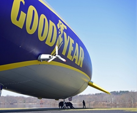 Goodyear airship ground crew help move the second Goodyear new technology airship to specific marked positions during a compass swing. Photo: David Dermer - Akron Beacon Journal.